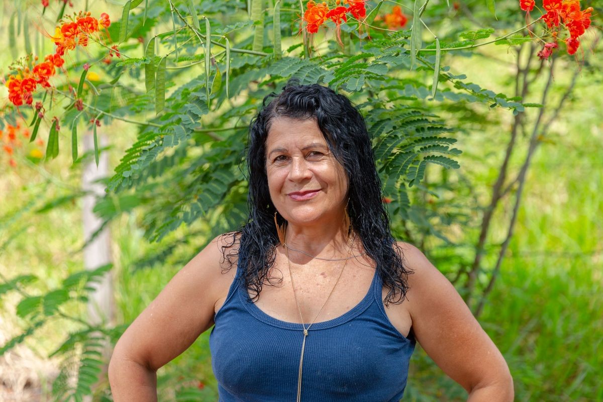 Middle aged woman looking at camera with happy smile